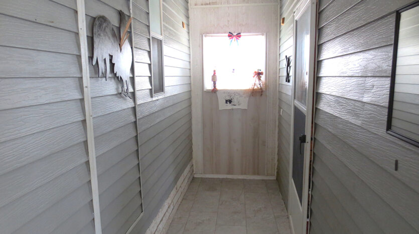 Enclosed Carport View to Shed